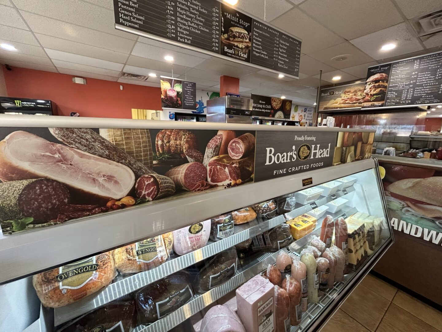 A display case in a bakery with many different types of pastries.