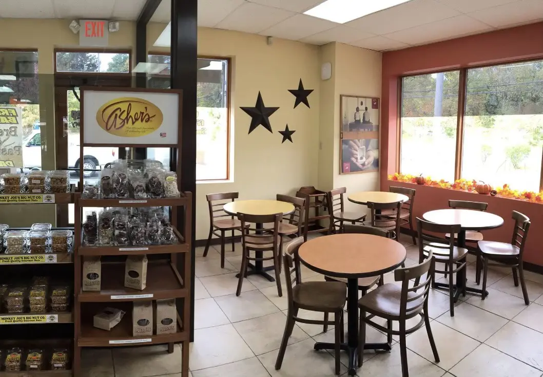 A restaurant with tables and chairs in it