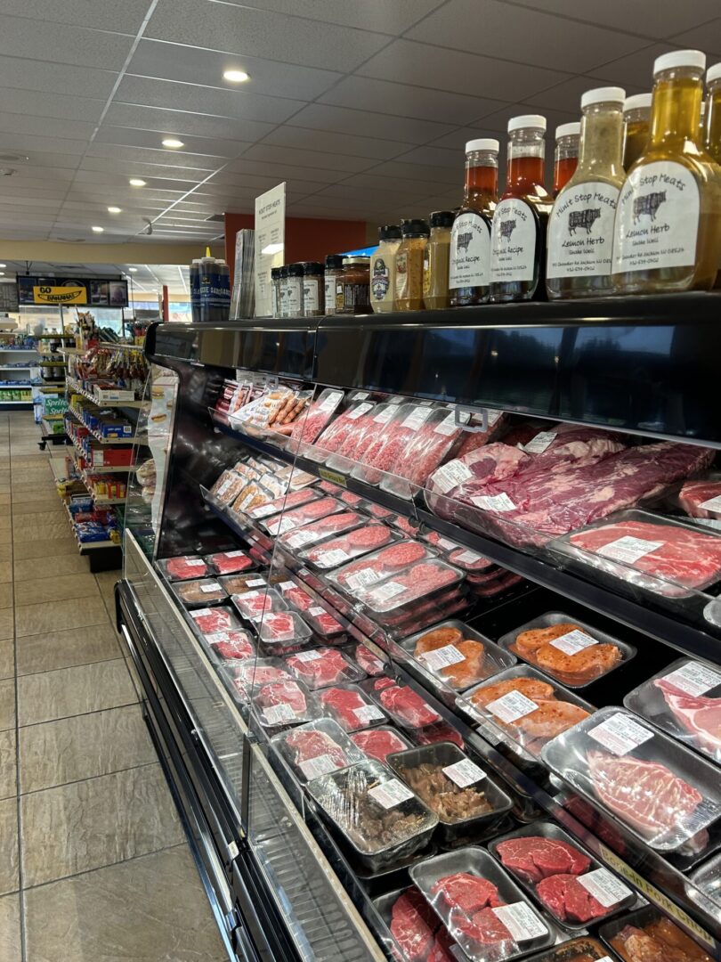 A meat and wine shop with many different types of meats.